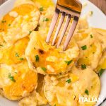 closeup of a plate of cheesy potatoes au gratin