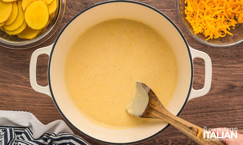cheese sauce for potatoes au gratin in a large pot