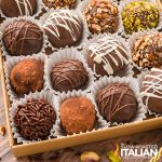 closeup of decorated chocolate truffles in a box