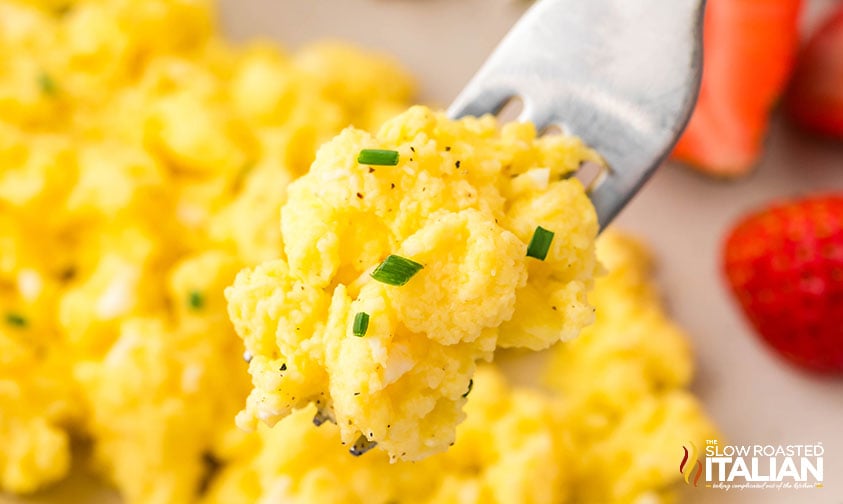 closeup of creamy cottage cheese eggs garnished with chives