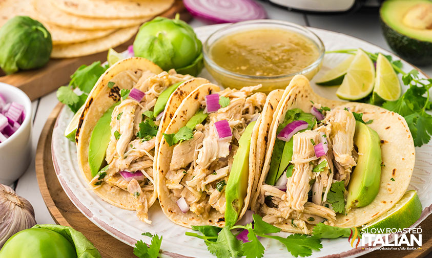 3 salsa verde chicken tacos on a plate