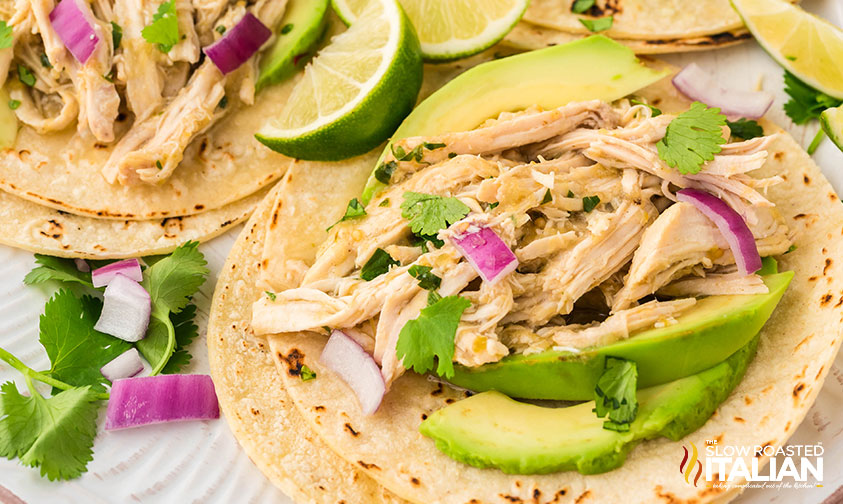 closeup of salsa verde chicken on tortillas