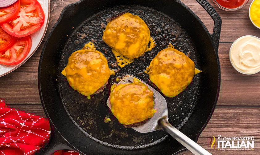 gooey melted cheese on 4 burger patties