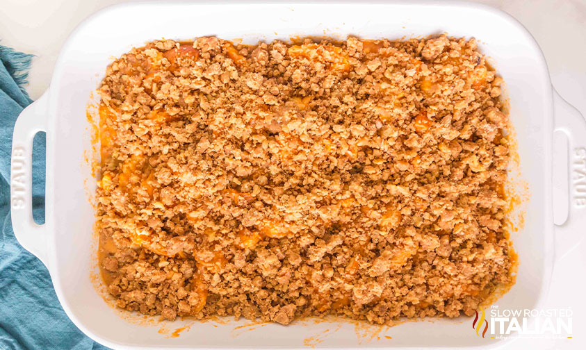 adding streusel topping to pumpkin pie french toast casserole