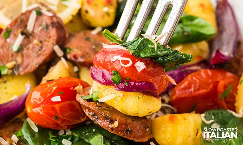closeup of sheet pan gnocchi on a fork
