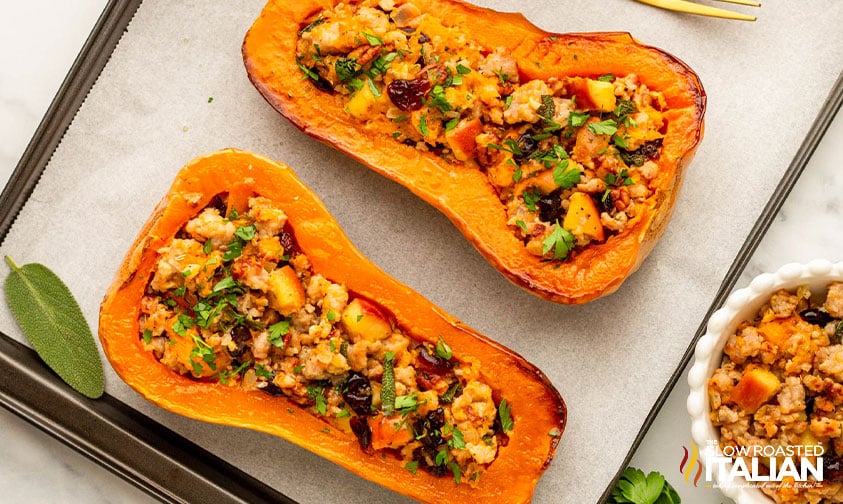 roasted stuffed butternut squash on a baking sheet