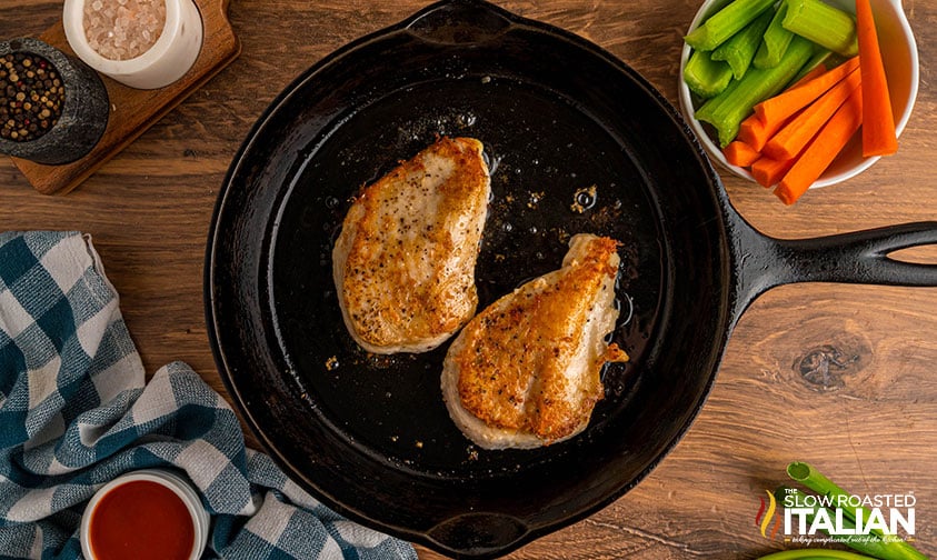 seared chicken breasts in cast iron pan