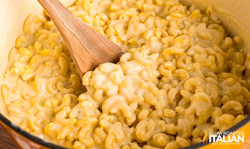stirring mac and cheese in pot