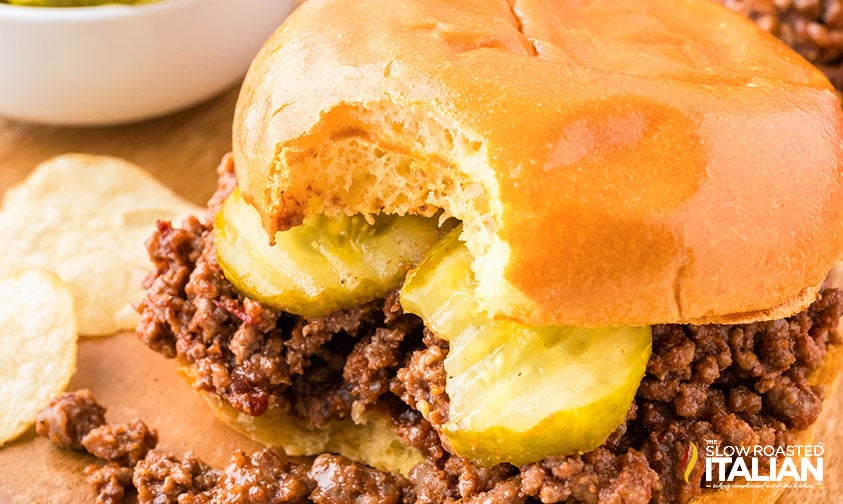 closeup of easy sloppy joes on a bun with sliced pickles