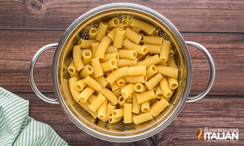 cooked pasta in a metal colander