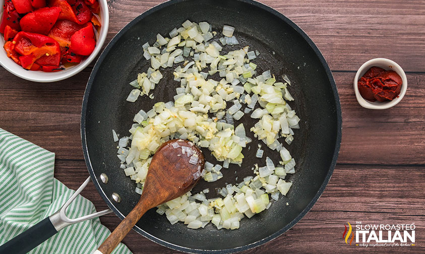 sautéing onion and garlic in a skillet