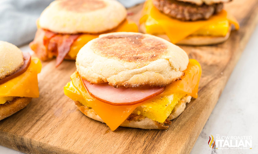 freezer breakfast sandwiches on a wooden board