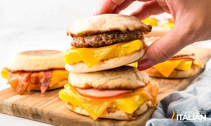 closeup of a hand holding freezer breakfast sandwiches