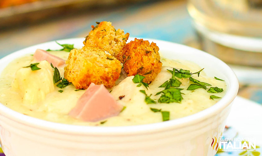 closeup of chicken cordon bleu soup topped with croutons and parsley