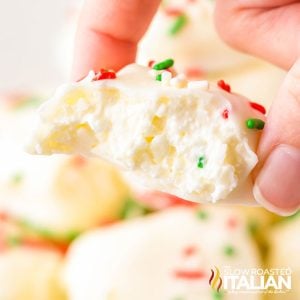 closeup of a hand holding cool whip candy