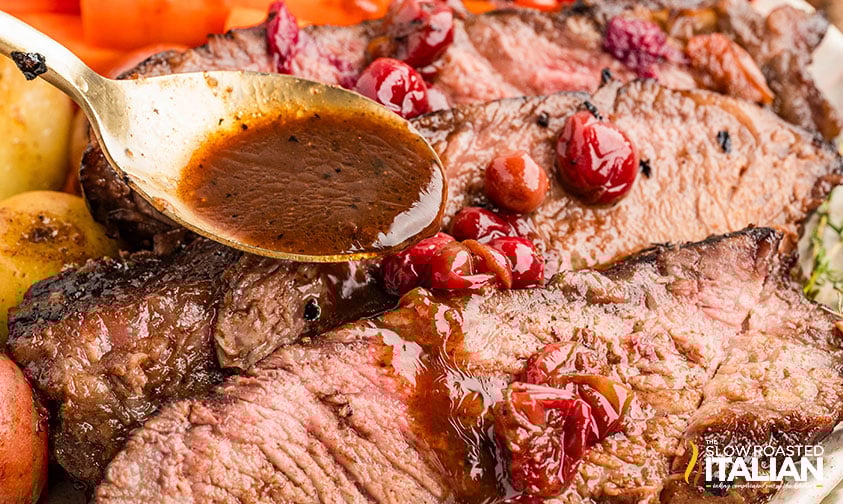 sliced cranberry christmas roast on a plate