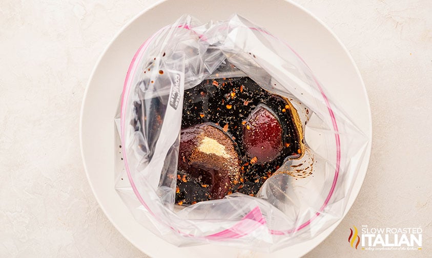 mixed marinade and christmas roast in a large zip top bag