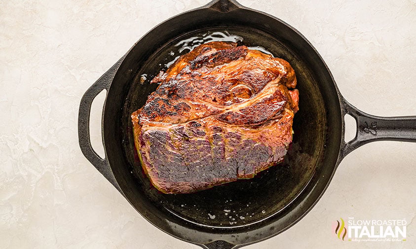 seared christmas roast in a cast iron skillet