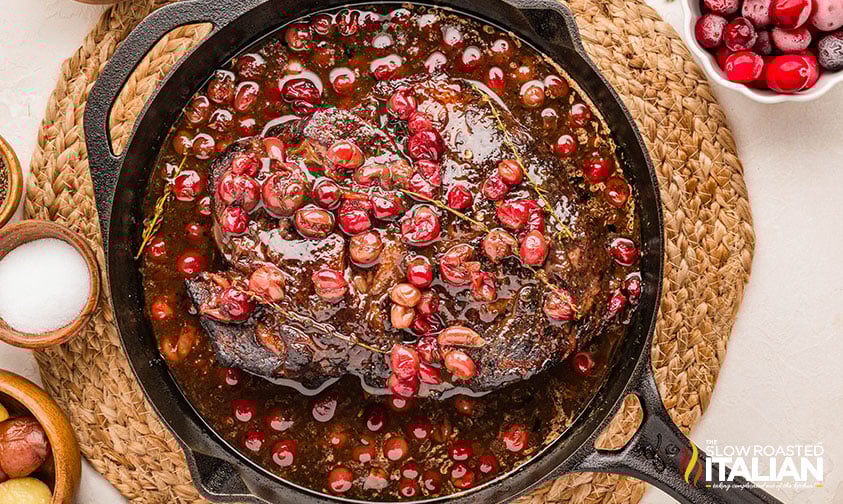 cooked cranberry christmas roast in a skillet