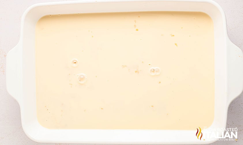 eggnog tres leches batter in a 9x13 baking dish