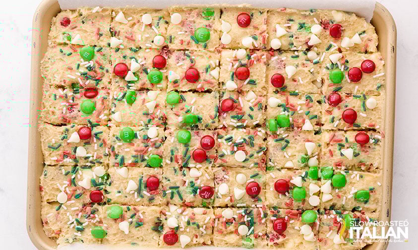 spread christmas cookie dough in a pan and score for giftable cookie dough