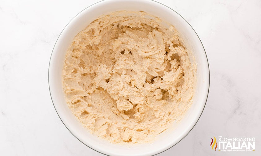 creamed butter and sugar for christmas cookie dough in a large bowl