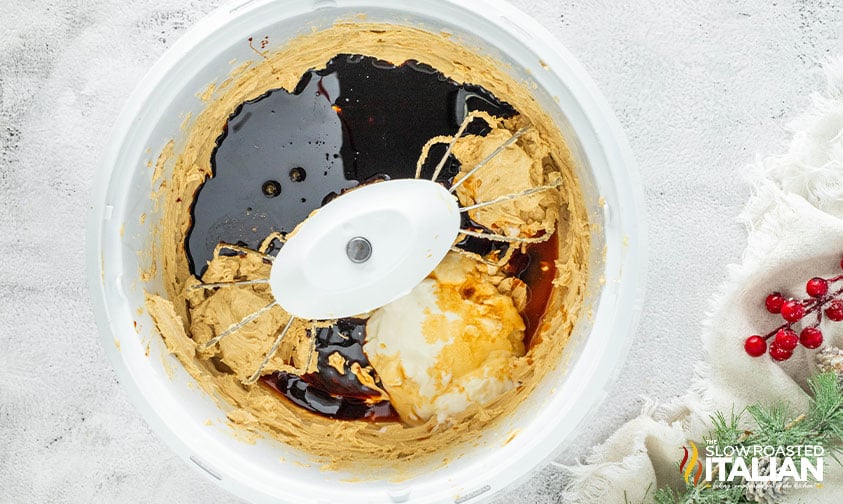 adding dry ingredients, molasses, and greek yogurt to large mixing bowl