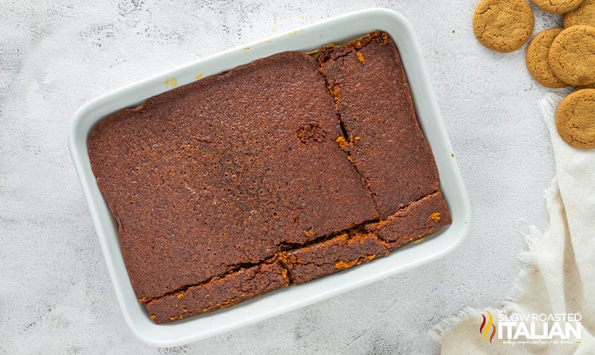 adding gingerbread cake to molasses mousse and gingersnap cookies