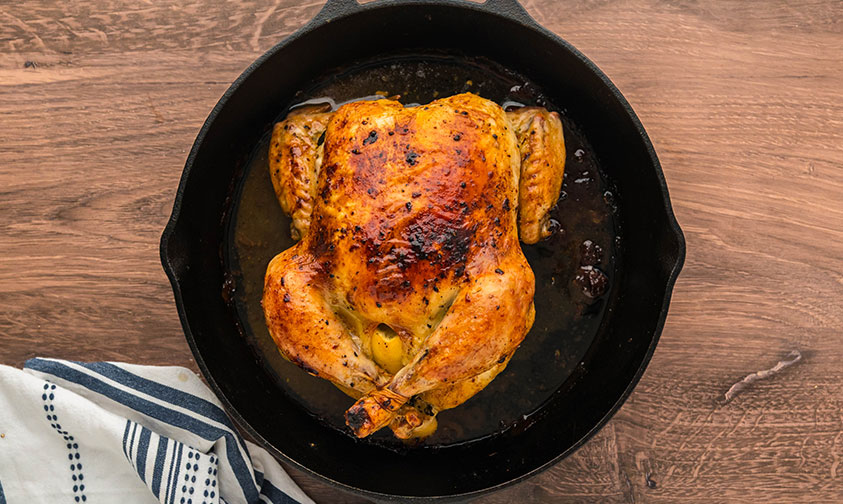lemon roasted chicken in a cast iron skillet