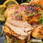 closeup of sliced lemon roasted chicken