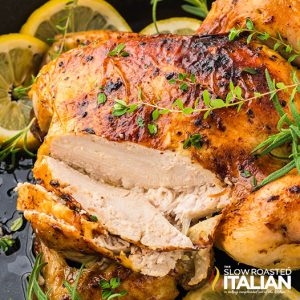 closeup of sliced lemon roasted chicken