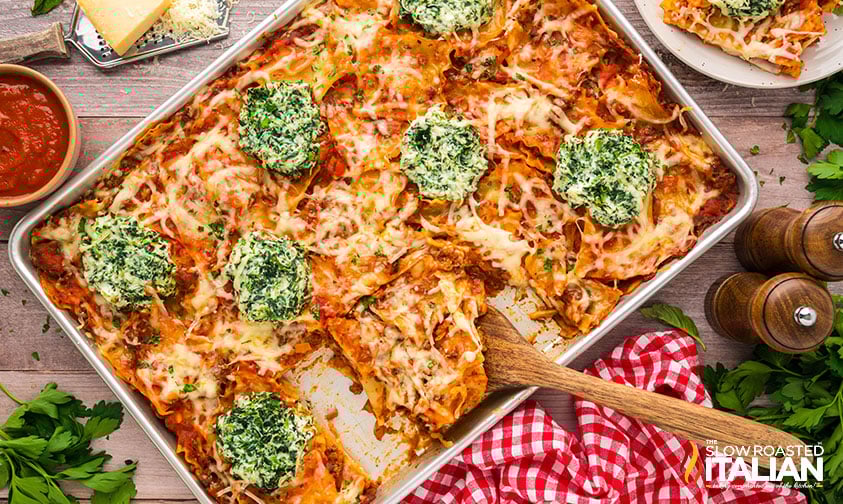 top view of sheet pan lasagna being served