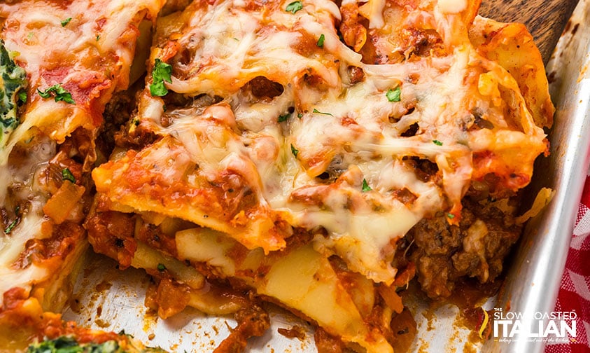 sliced sheet pan lasagna covered with melted cheese