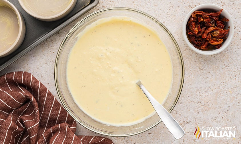 mixed ricotta in a large mixing bowl