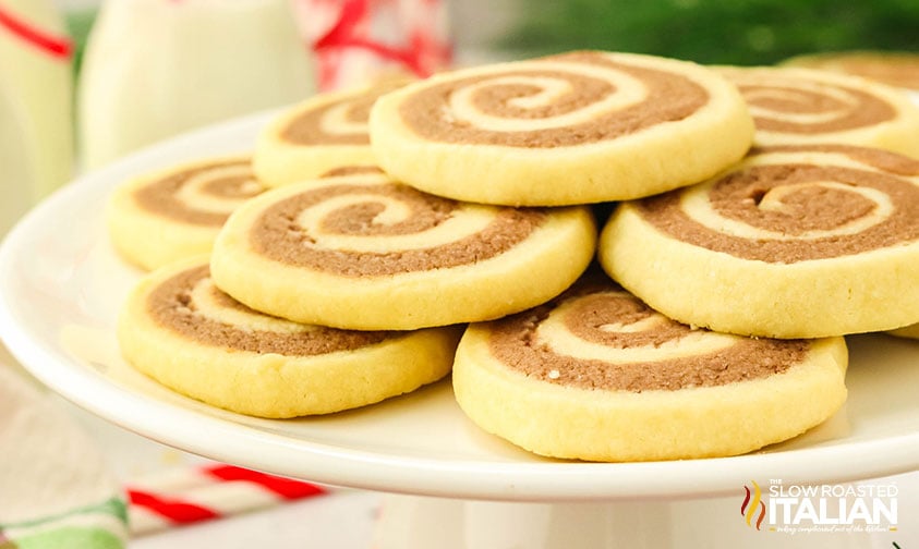 stacked chocolate pinwheel cookies on a plate