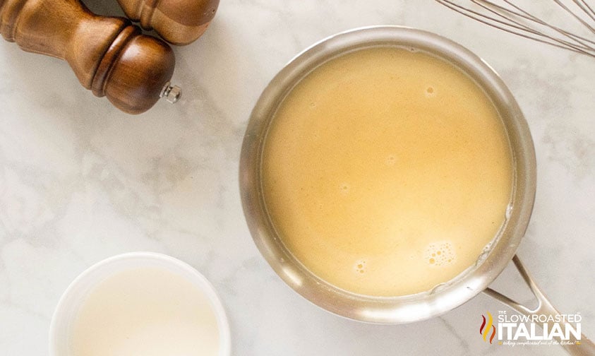 chicken stock added to small sauce pan for homemade condensed cream of chicken soup