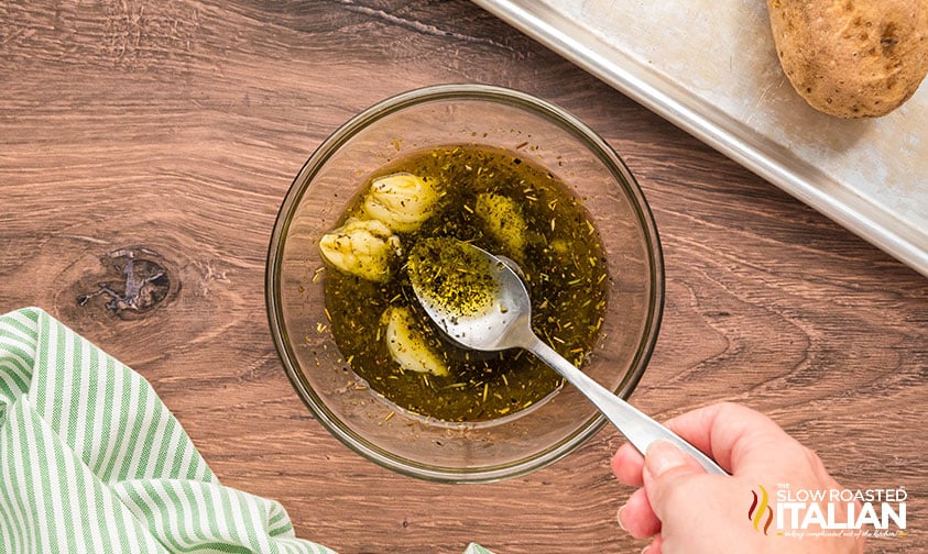 mixed garlic oil in a small bowl for brushing on italian potato skins