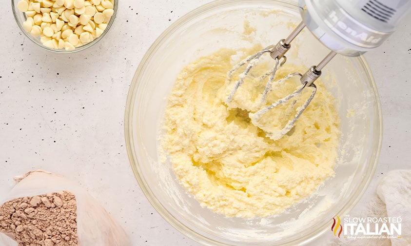creamed butter and sugar in a bowl for red velvet cake mix cookies