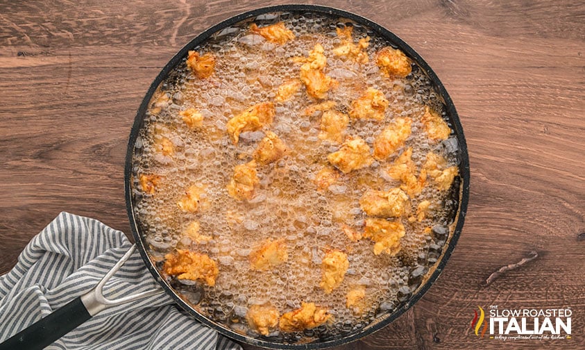 frying simple orange chicken in a large skillet