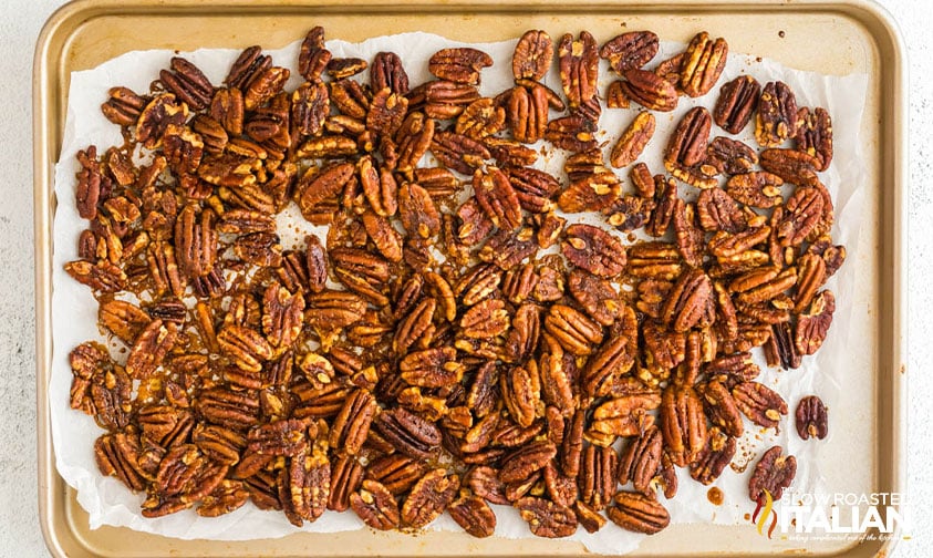baked spiced pecans recipe on a sheet pan