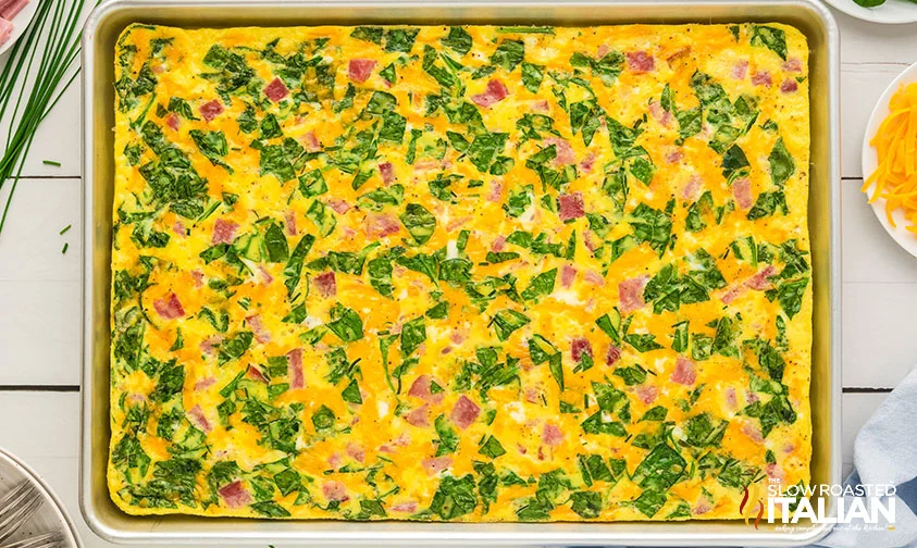 sheet pan eggs with ham, cheese, and spinach