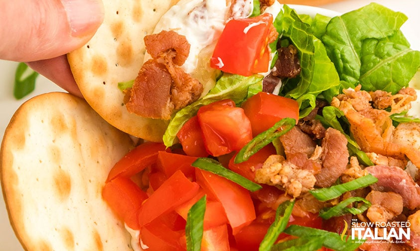 closeup of cracker dipped in blt dip