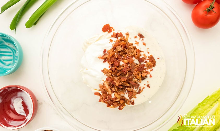cream cheese and crumbled bacon in a small bow for BLT dip