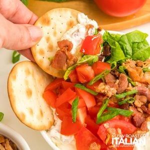 closeup of a cracker dipped in BLT dip