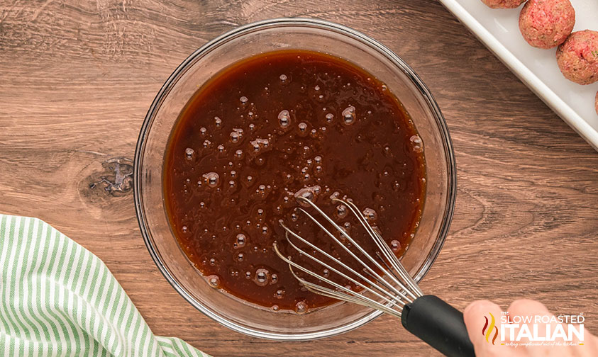 mixing meatloaf meatball glaze in a small bowl