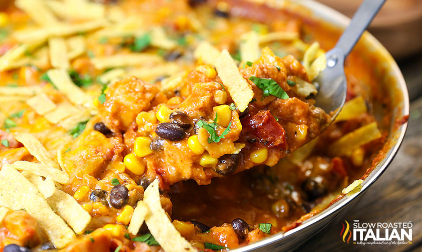 closeup of cheesy chicken enchilada skillet