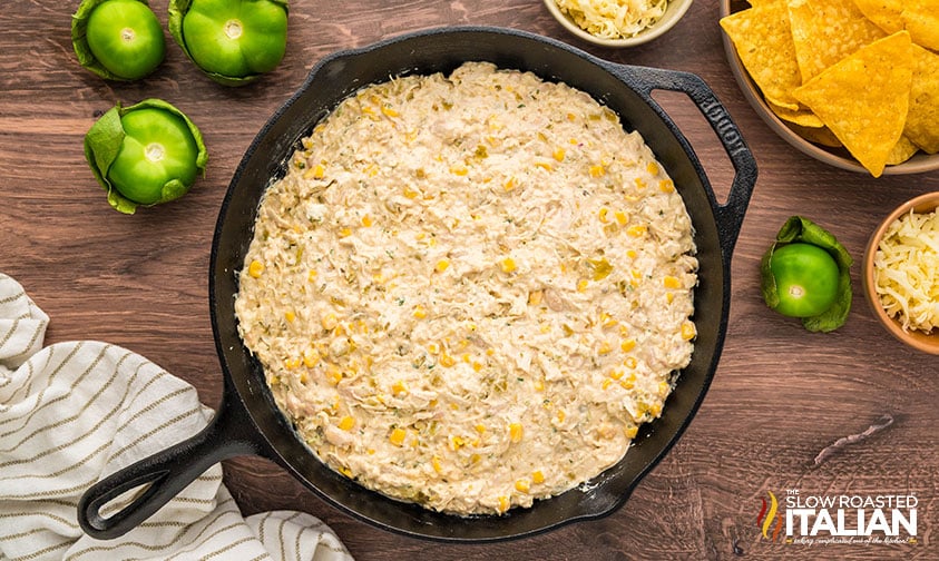 chicken enchilada dip transferred to a cast iron skillet
