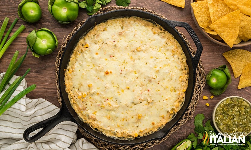 baked chicken enchilada dip in a cast iron skillet
