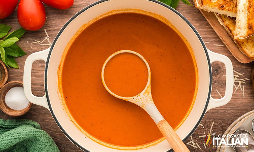 smooth and creamy roasted tomato soup in a large pot