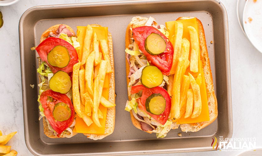 adding toppings to gatsby sandwich